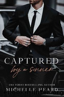 Captured By A Sinner by Michelle Heard