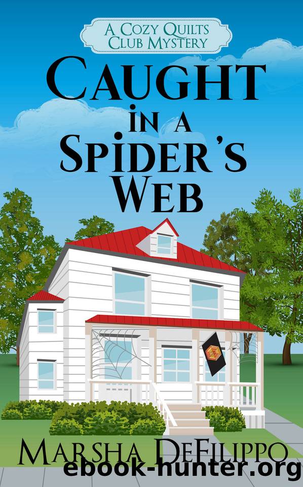 Caught in a Spider's Web: A Cozy Quilts Club Mystery by Marsha DeFilippo