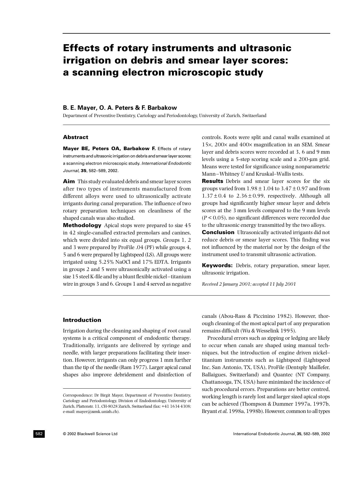 Effects of rotary instruments and ultrasonic irrigation on debris and smear layer scores a scann by Unknown