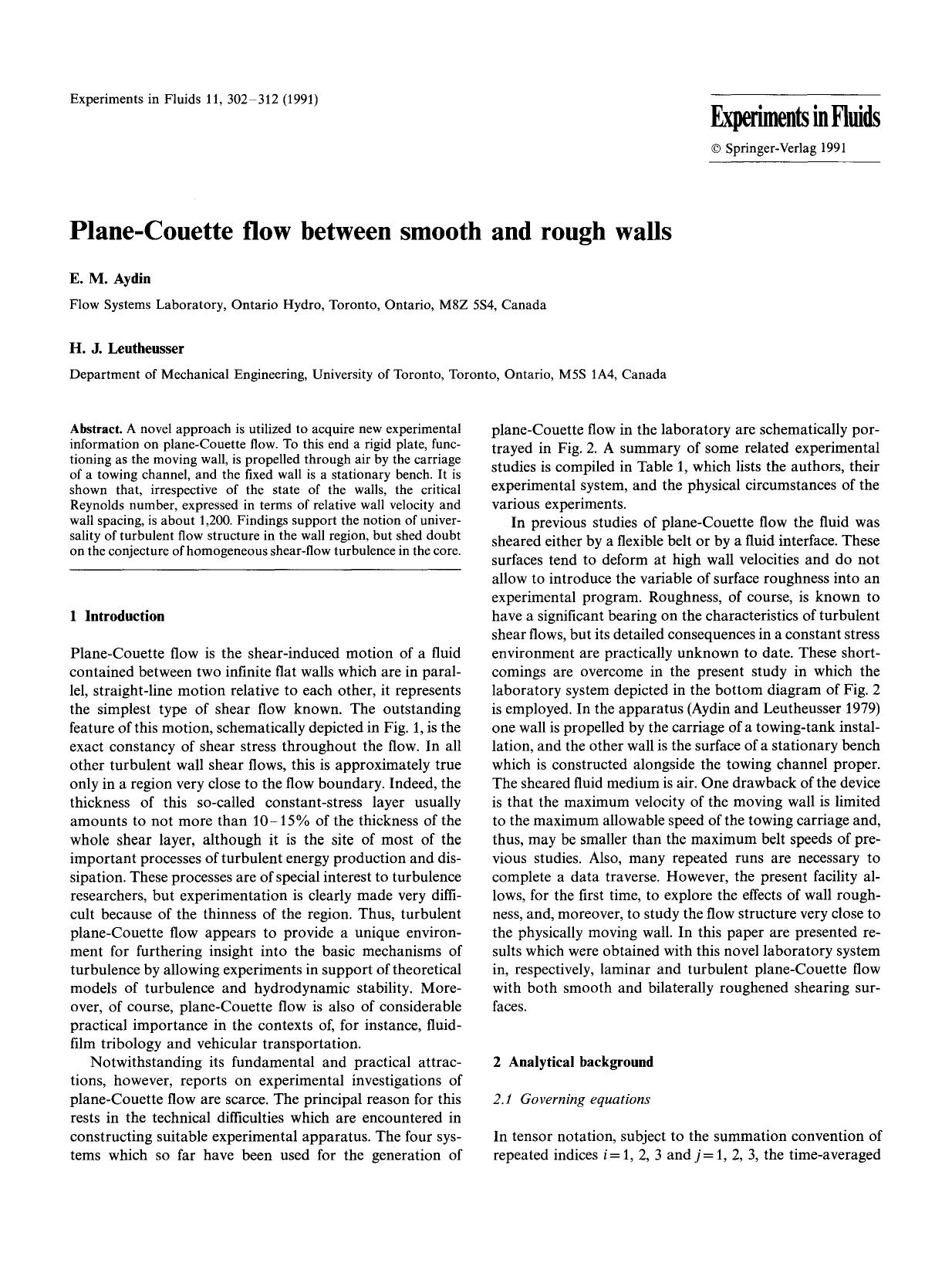 Plane-Couette flow between smooth and rough walls by Unknown