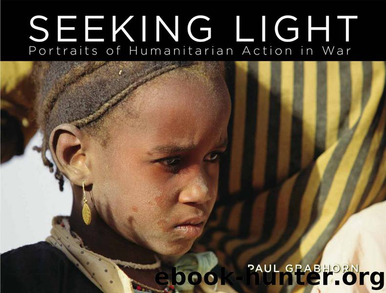 Seeking Light: Portraits of Humanitarian Action in War by Grabhorn Paul
