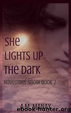She Lights Up the Dark by A.M. Manay