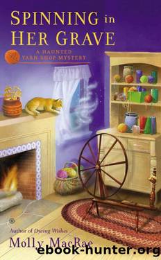 Spinning in Her Grave: A Haunted Yarn Shop Mystery (Haunted Yarn Mystery) by MacRae Molly
